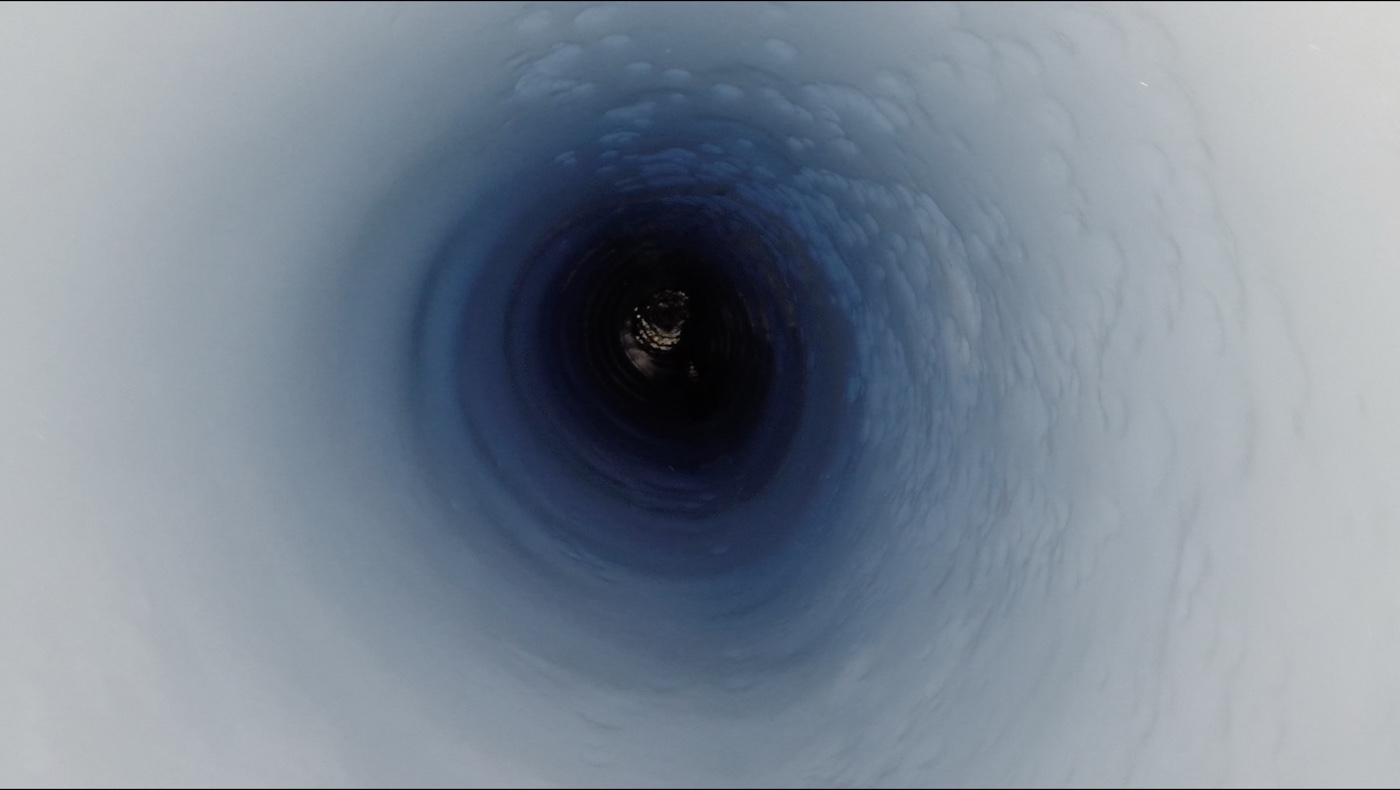 Here, the view down the borehole at about 3,500 feet (1,070 meters) below the ice, just above the surface of the subglacial lake in Antarctica.