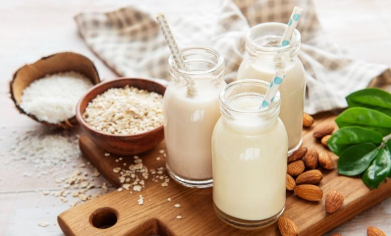 Alternative types of vegan milks in glass bottles